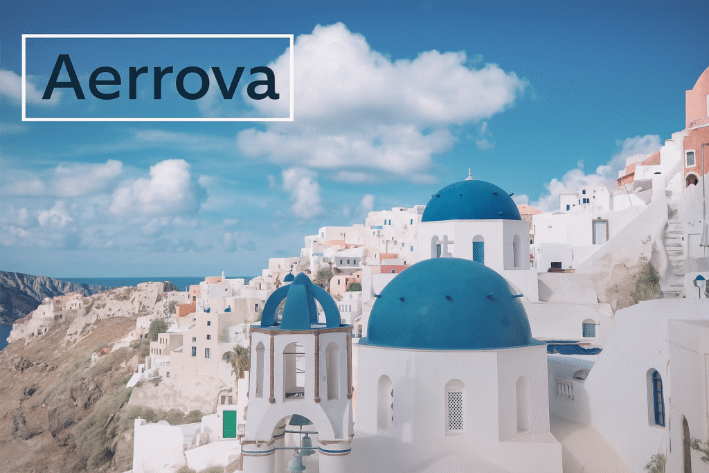 White-washed buildings with blue domes overlooking the Aegean Sea in Santorini, Greece at sunset.